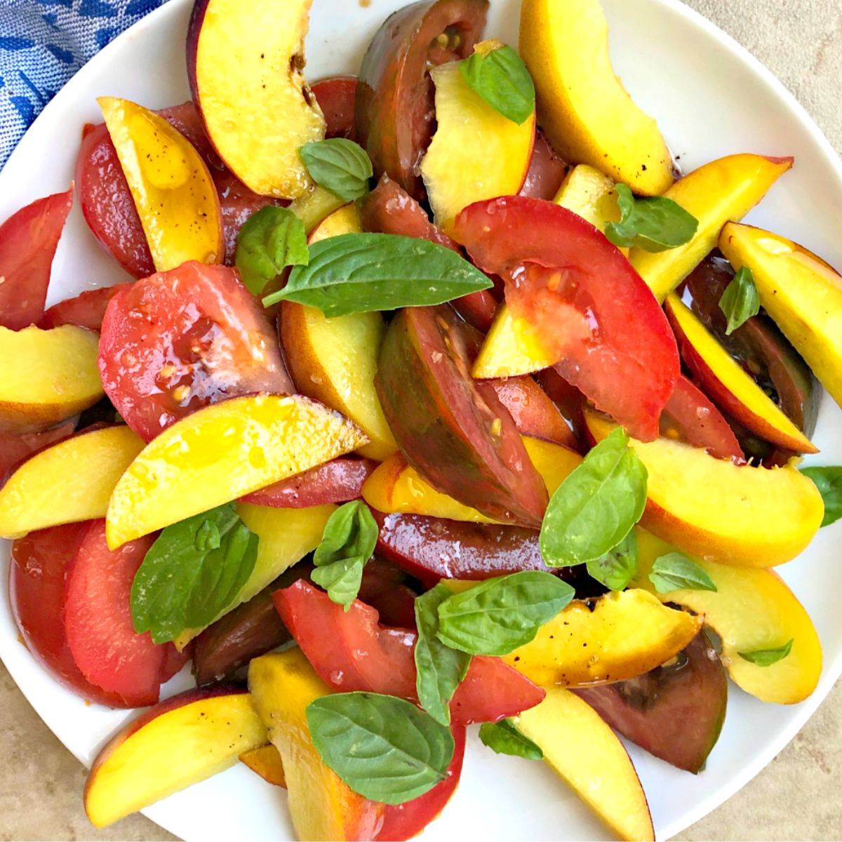 Peach and tomato salad with fresh basil.