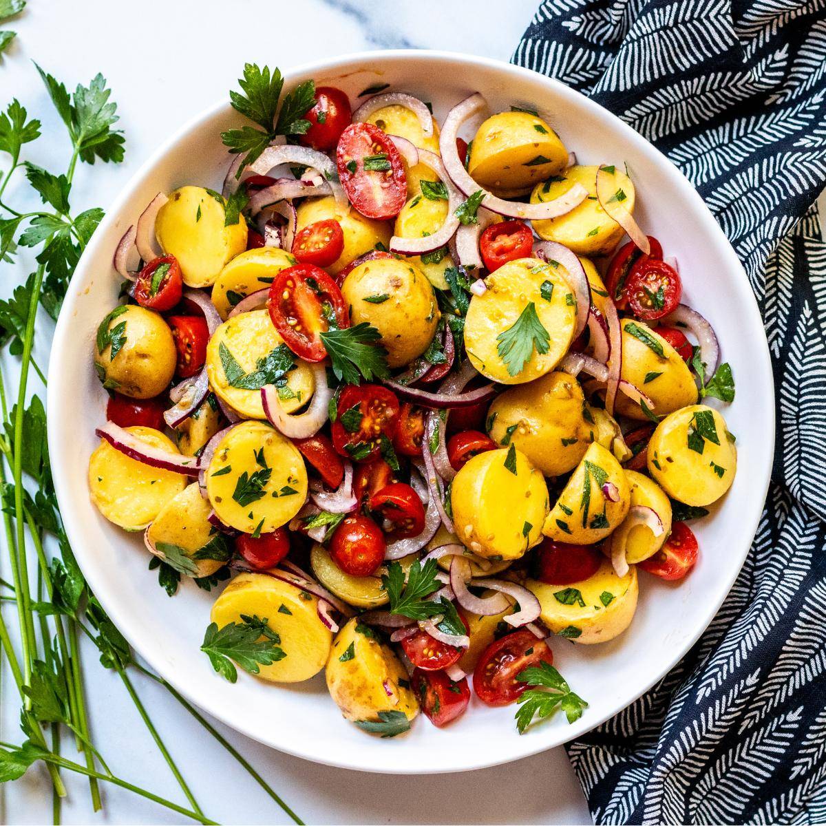 Bowl of Italian potato and tomato salad.