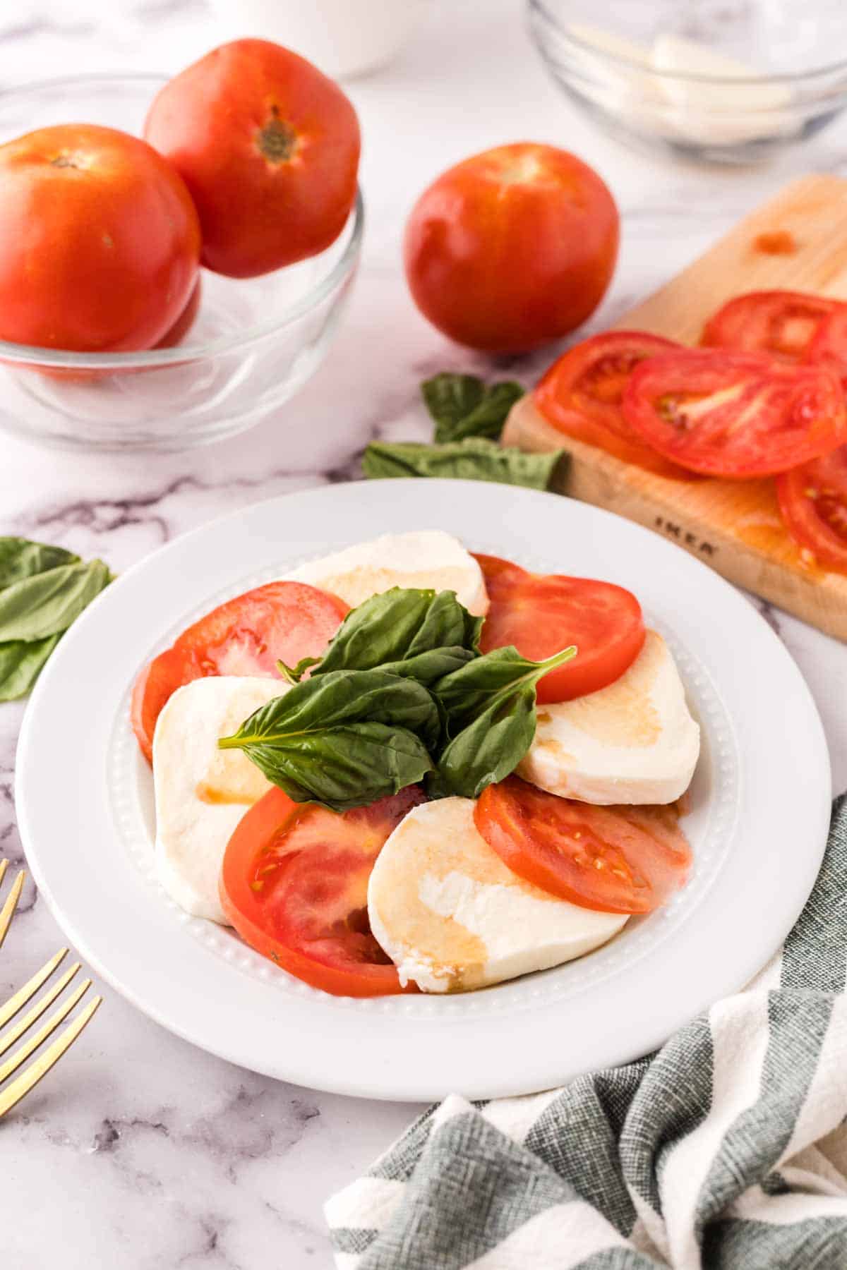 caprese salad on white plate.