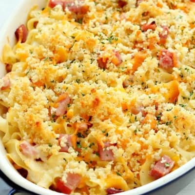 Casserole with ham and noodles in an oval baking dish.