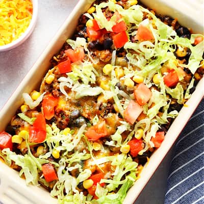 Taco casserole in a rectangular baking dish.