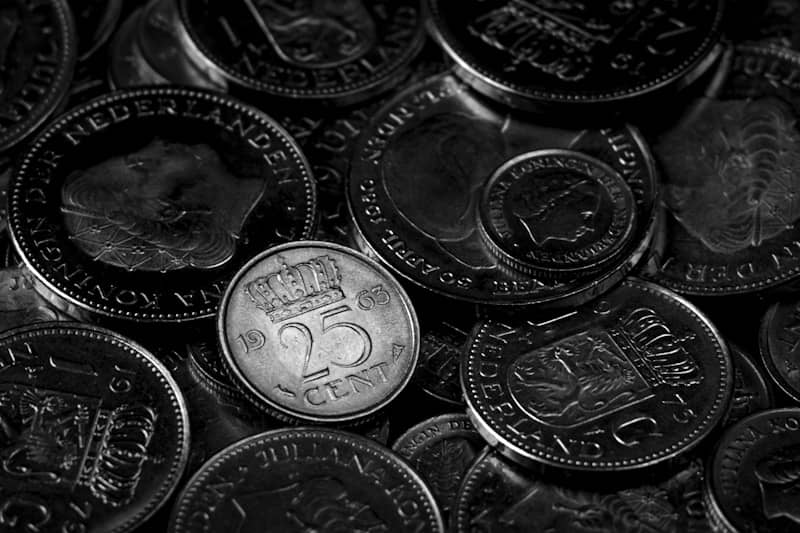 Pile of dutch coins in monochrome view.