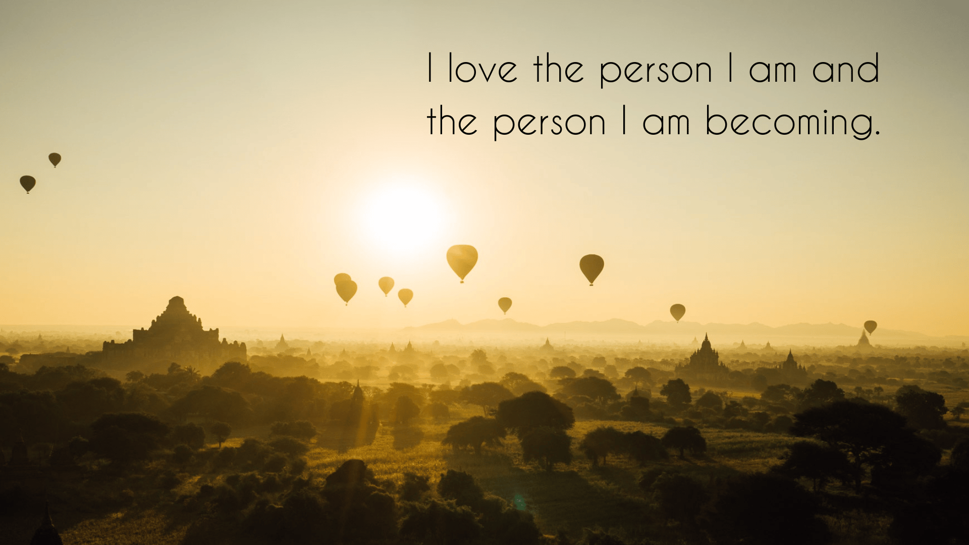 affirmation on a sunrise background with hot air balloons