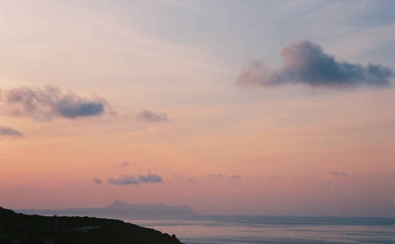 Sunset sky over the sea, softly colored.