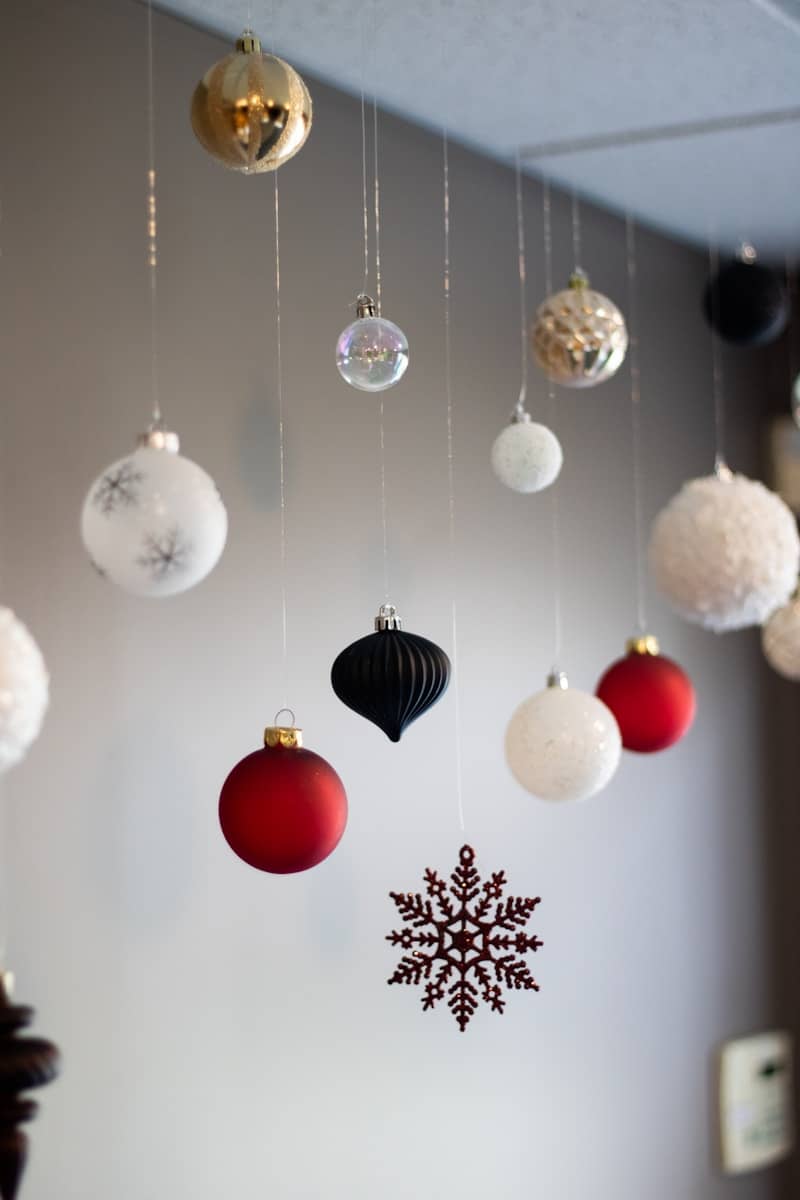 A bunch of ornaments hanging from a ceiling