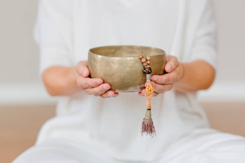 A person holding a bowl in their hands