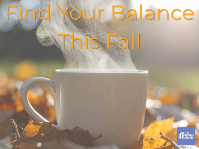 A steaming white coffee mug sits on golden autumn leaves in soft morning sunlight, with the words "Find Your Balance This Fall" across the top.