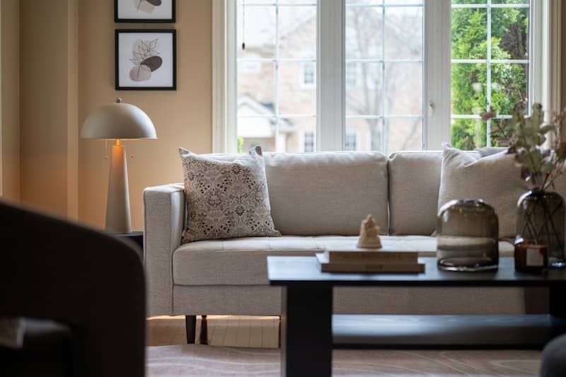 A bright living room with a sofa and coffee table.