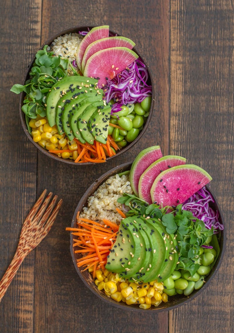 A couple of bowls filled with different types of food