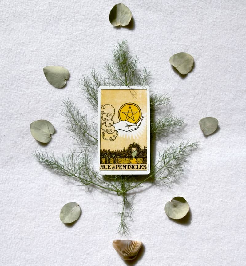 Tarot card ace of pentacles with decorative elements