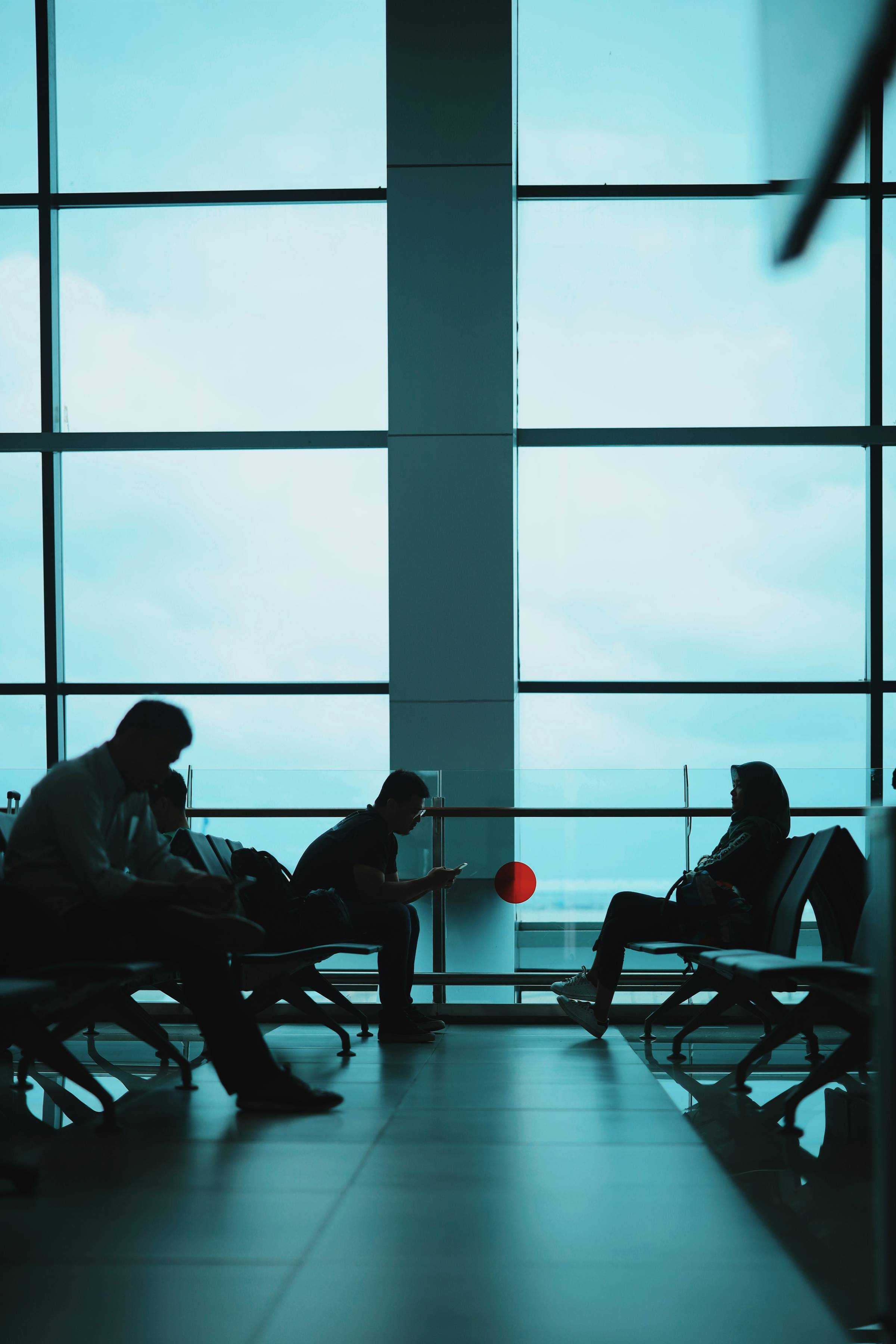people sitting at an airport terminal