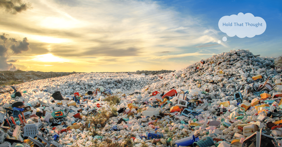 Colorful plastic waste hills at sunset.