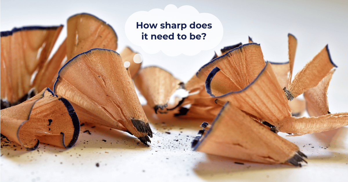 Close-up of pencil shavings. With thought bubble: How sharp does it need to be?