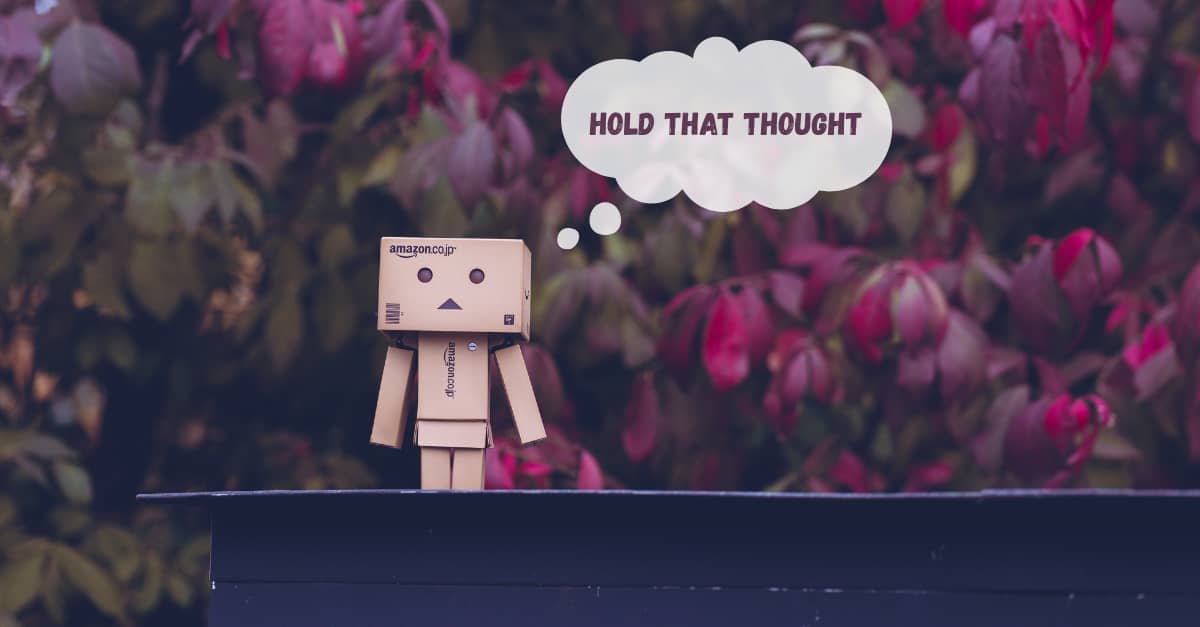 Amazon boxes in the shape of a robot person, contemplating life on a rooftop.