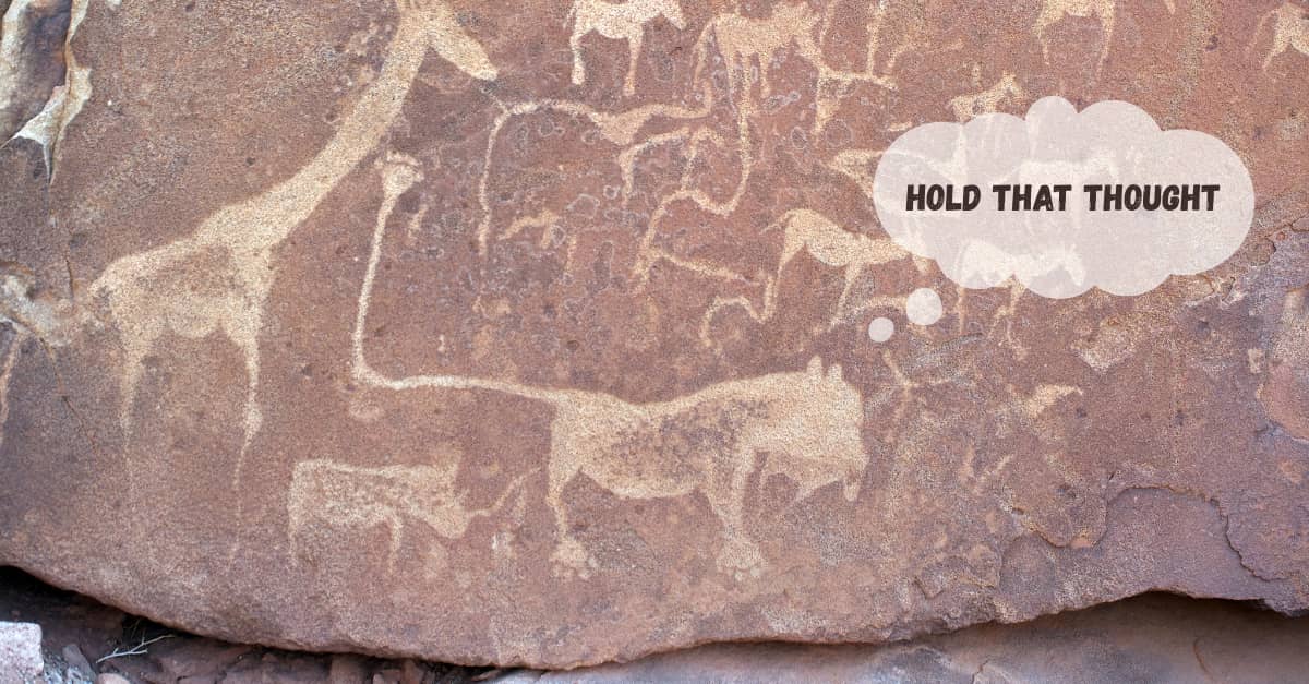 Close up of graffiti animals on a Stone Age boulder.