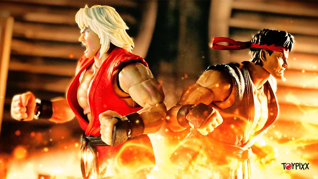 Jada Toys' Ultra Street Fighter 2 Violent Ken and Evil Ryu are back to back, with flames in the foreground