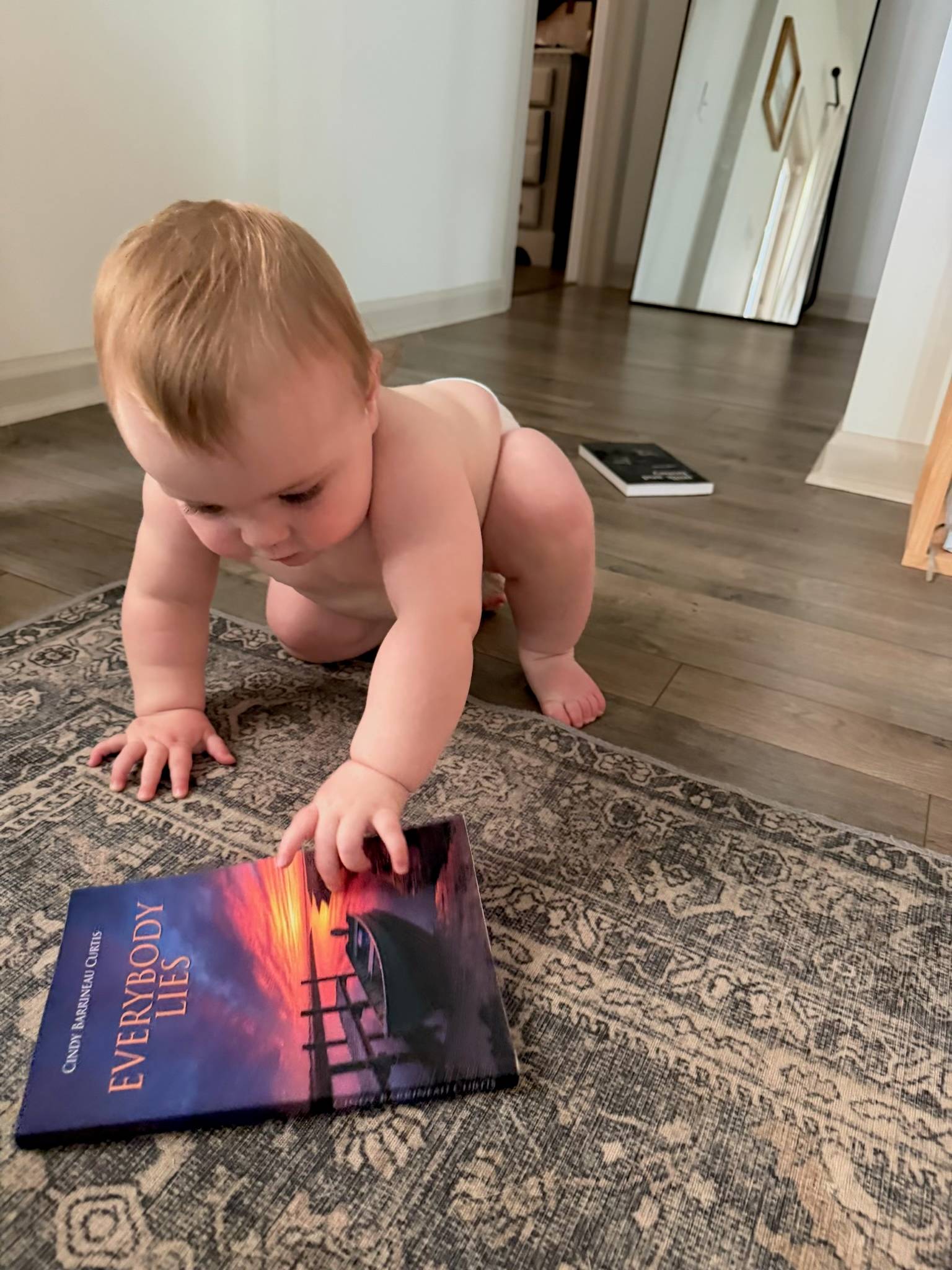 Everybody Lies book with a super cute baby
