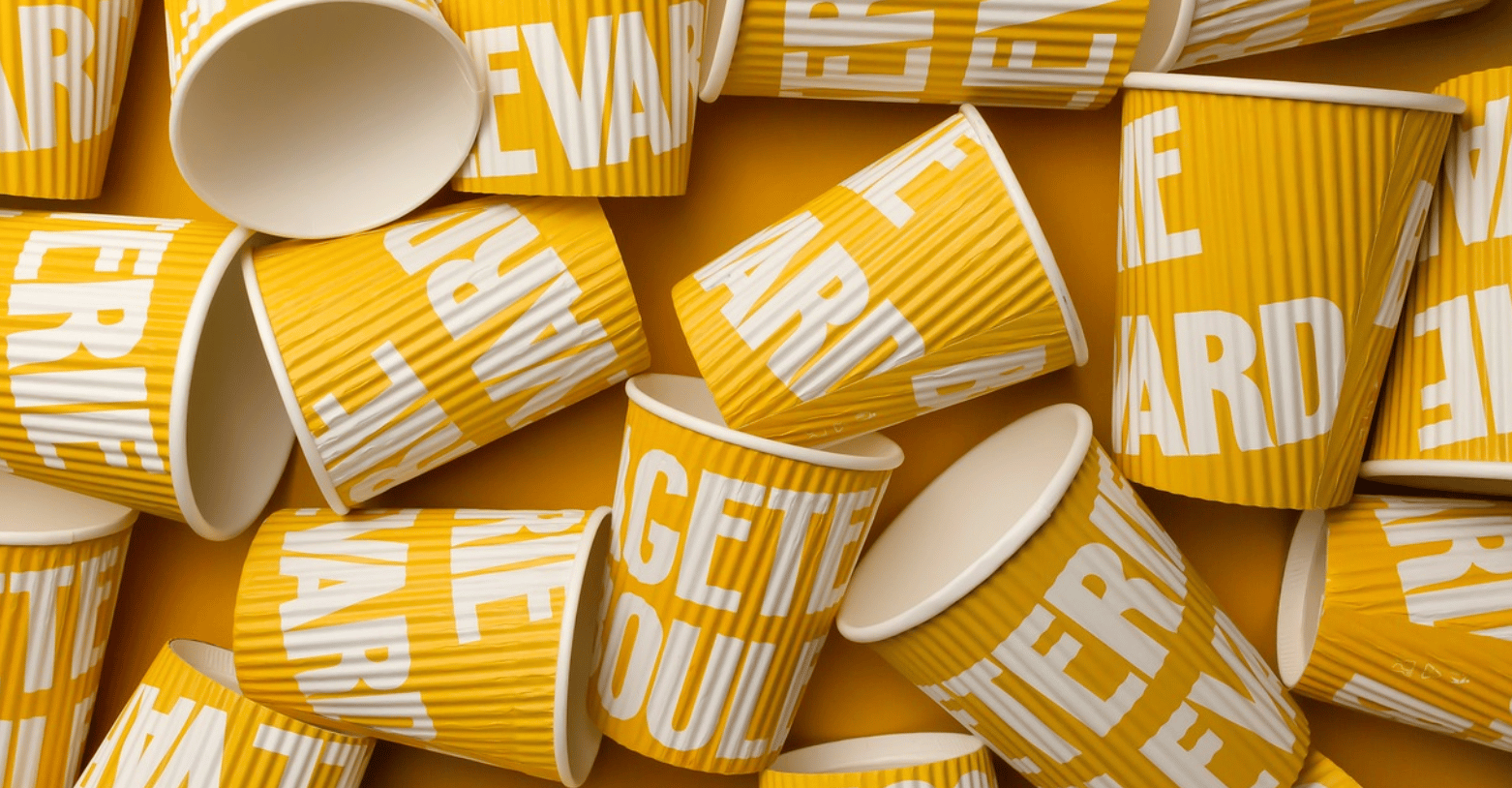 Excellent photo of bright yellow coffee cups.