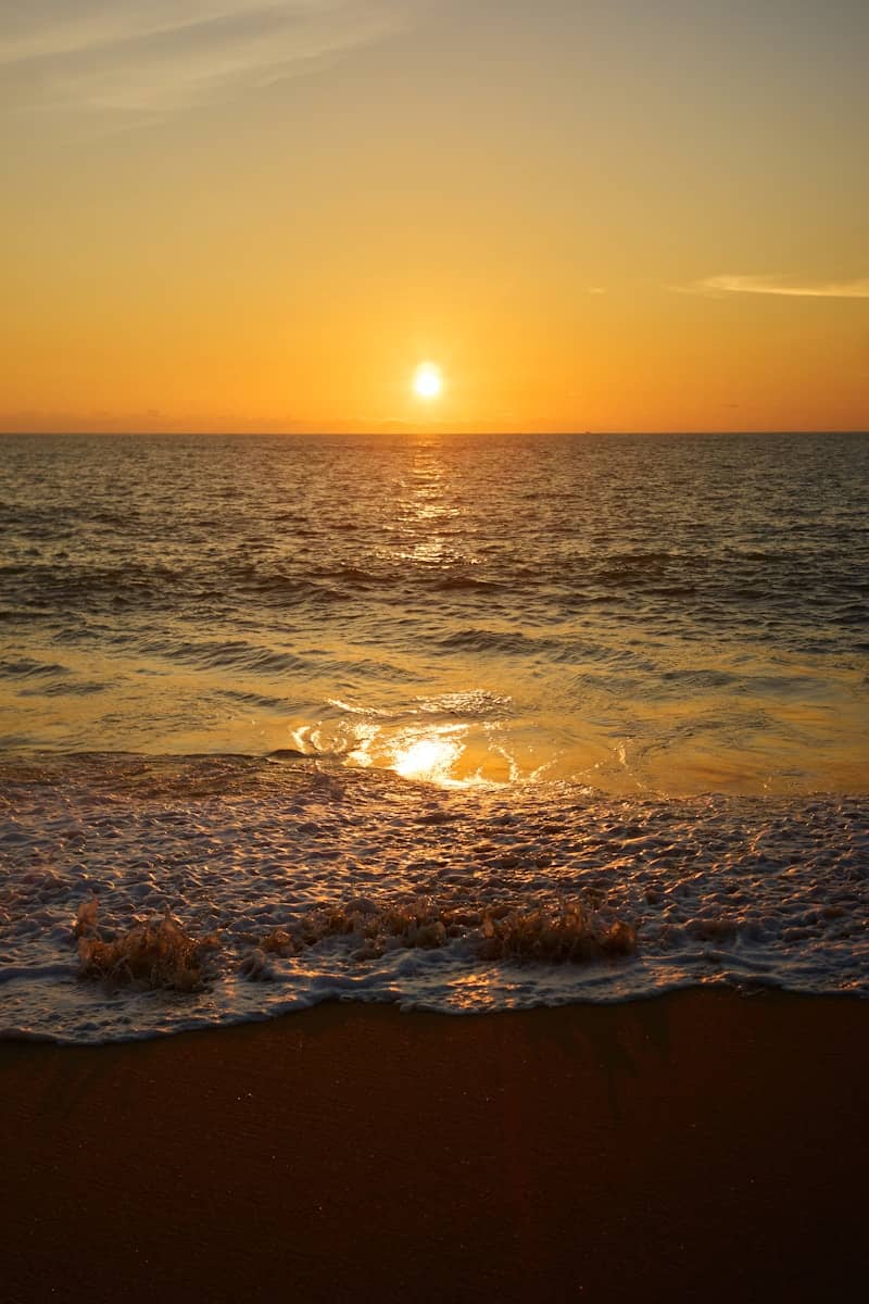 Golden sunset over the ocean waves