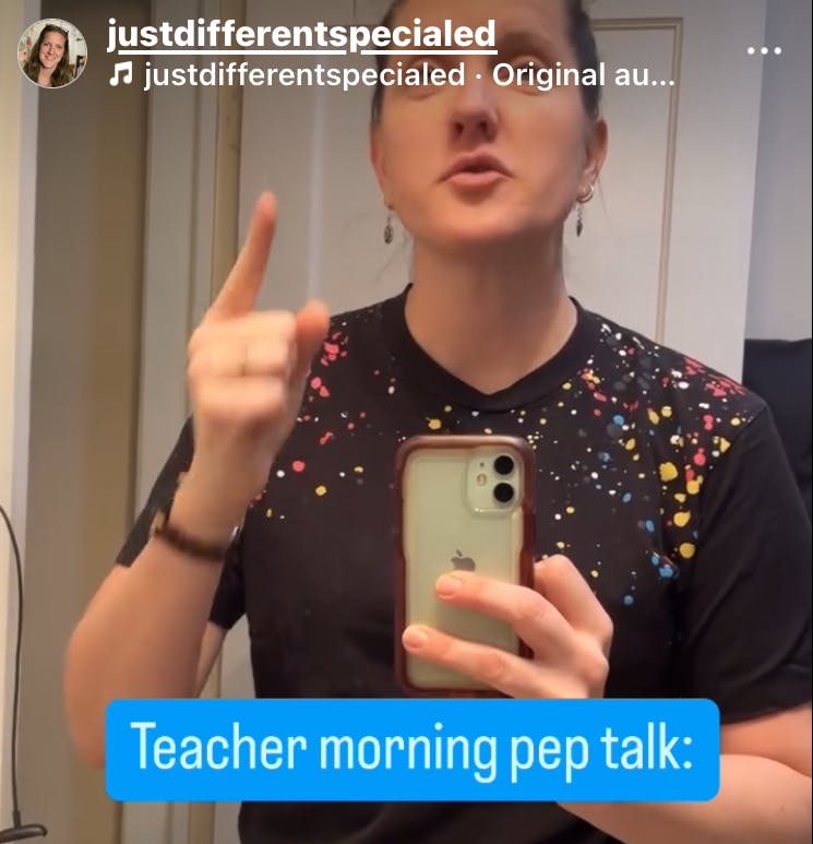 A woman looks into a mirror pointing to herself with an intense look on her face. Text on screen says Teacher morning pep talk.