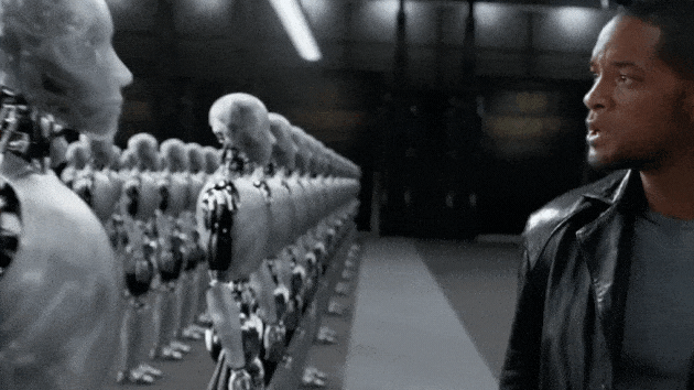 GIF shows clip from the movie "I, Robot," with Will Smith's character walking along a row of robots barking orders. The text, "Boost your biz with bots" slides in from the left. 