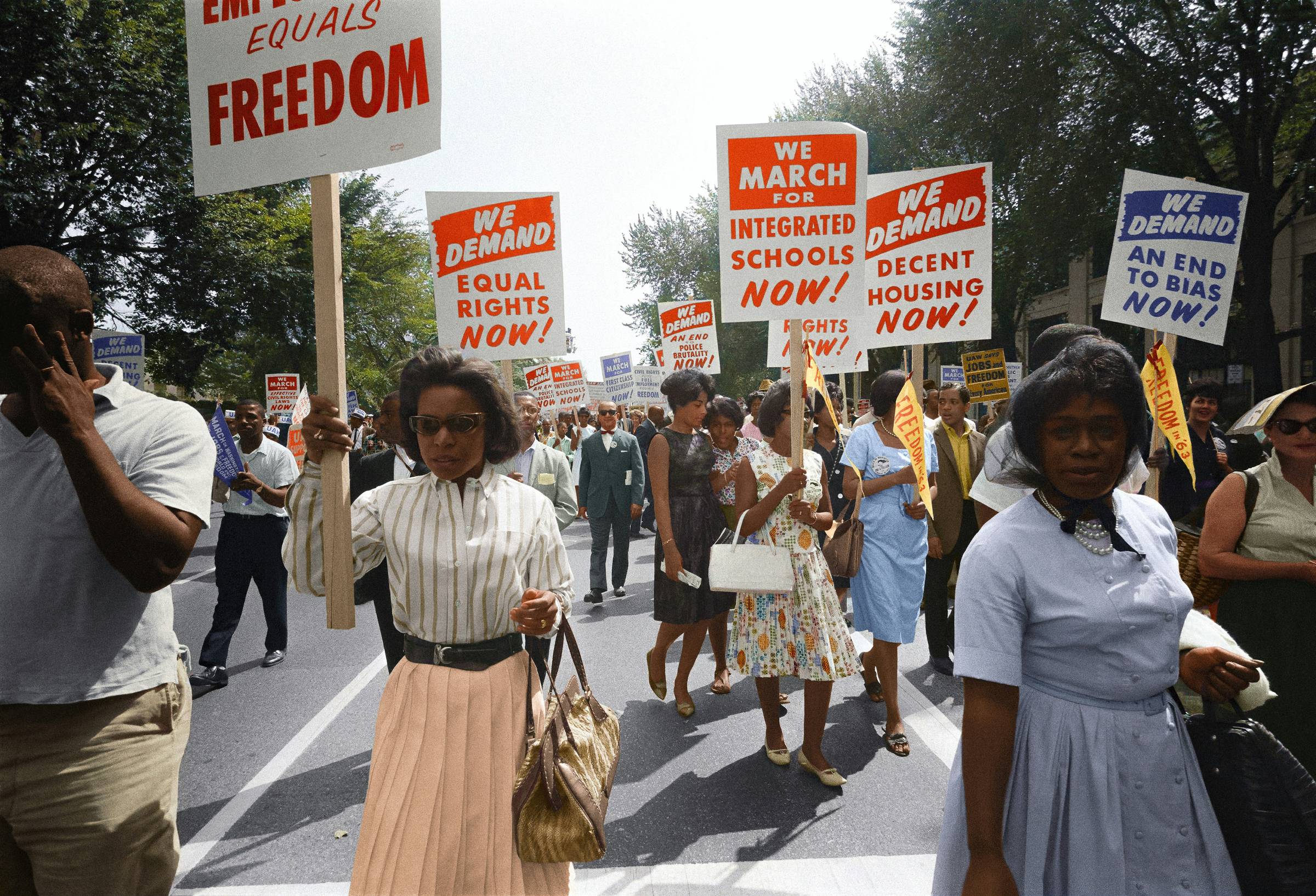 Black people protesting and holding up signs demanding freedom and equal rights. Used for a Black History Month newsletter. Image courtesy of Unseen Histories