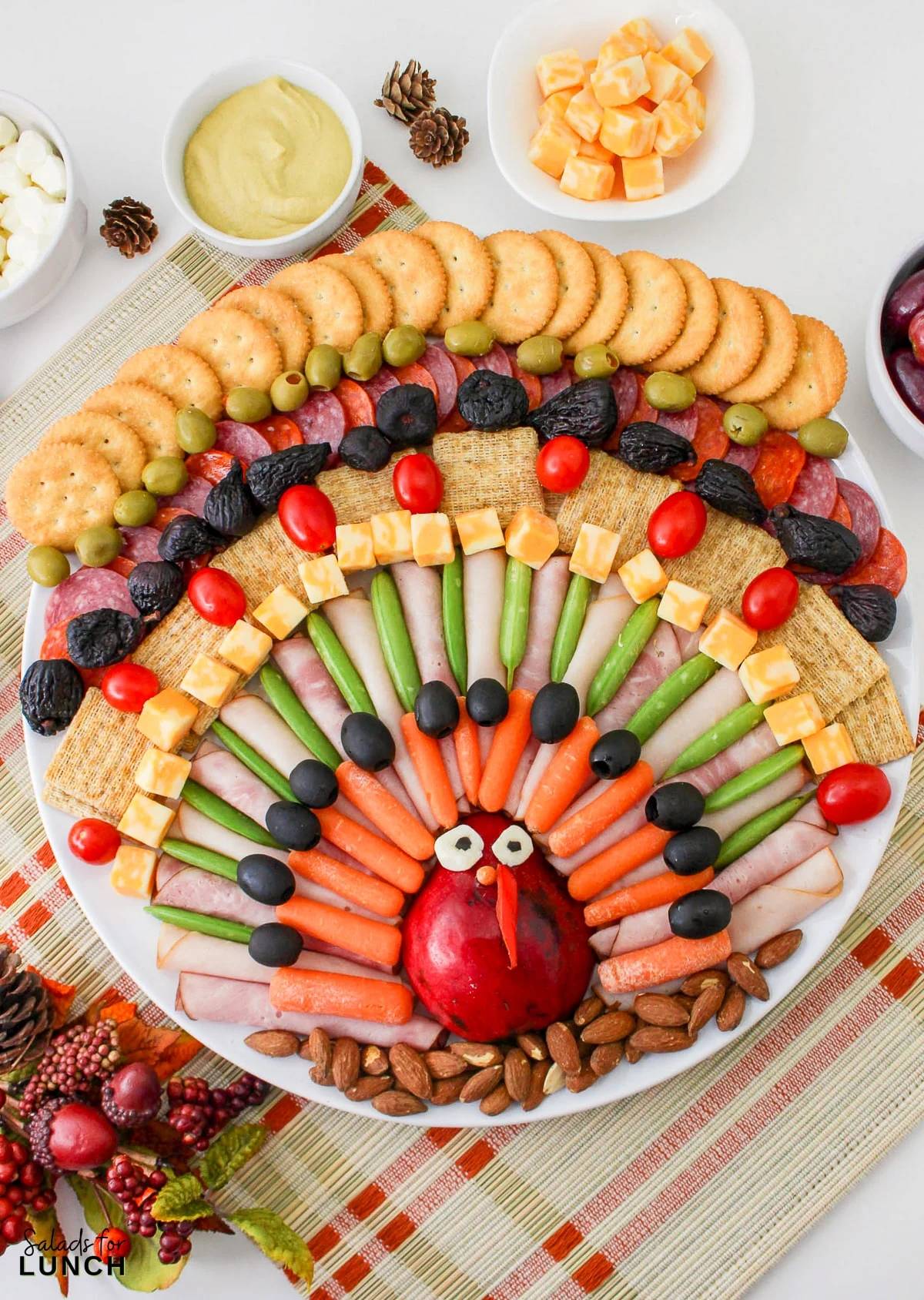 Turkey shaped charcuterie board for Thanksgiving.