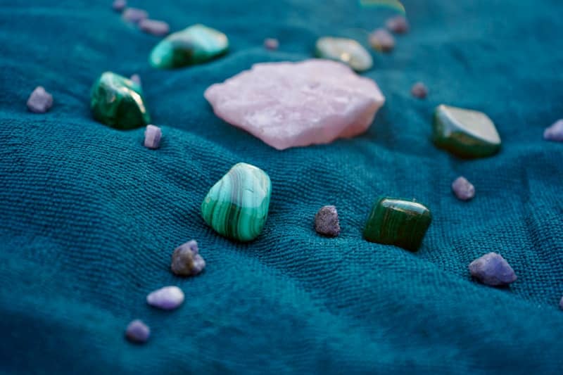 A close up of rocks and stones on a blue surface