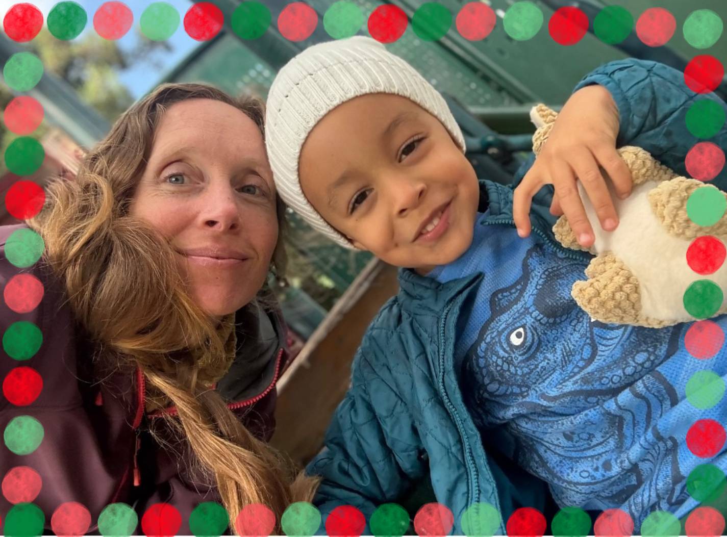 ID: Max and his mother posing for a picture