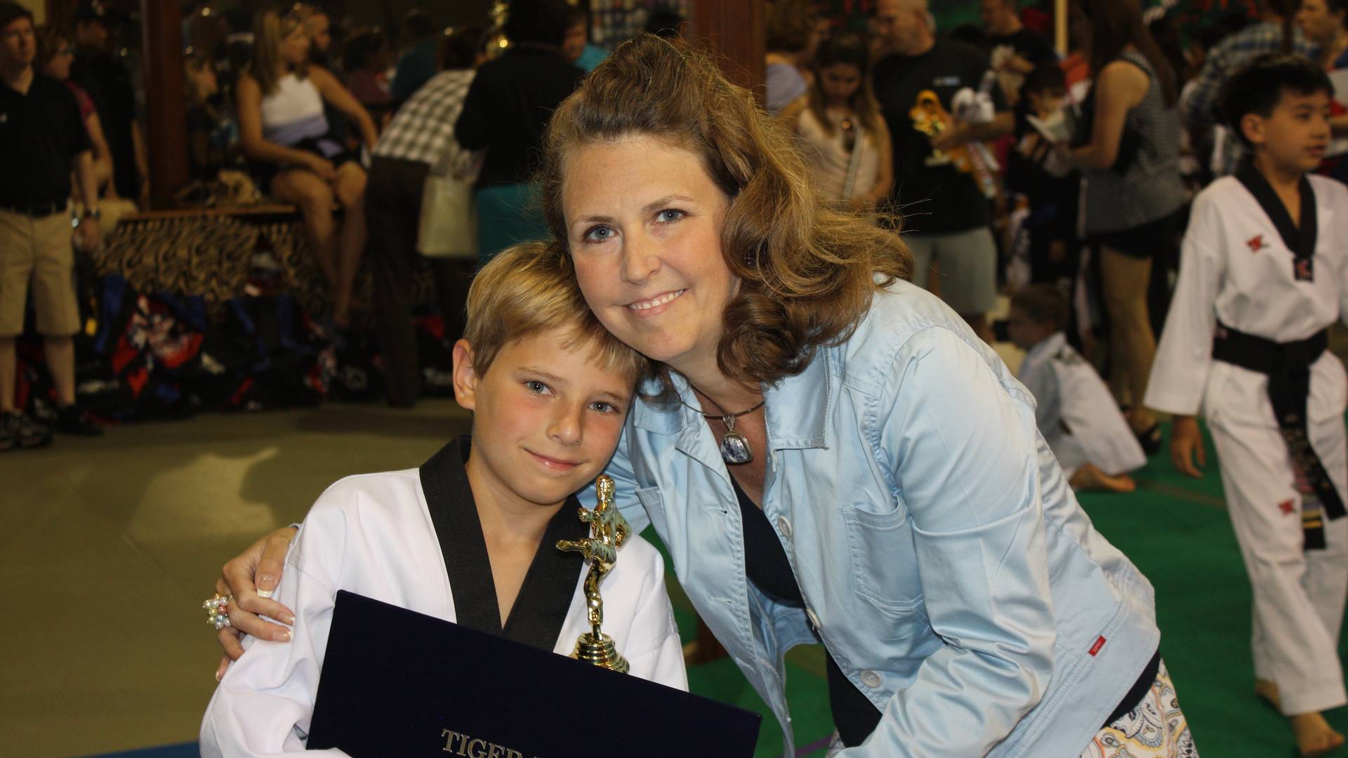 Amy and Zack black belt award
