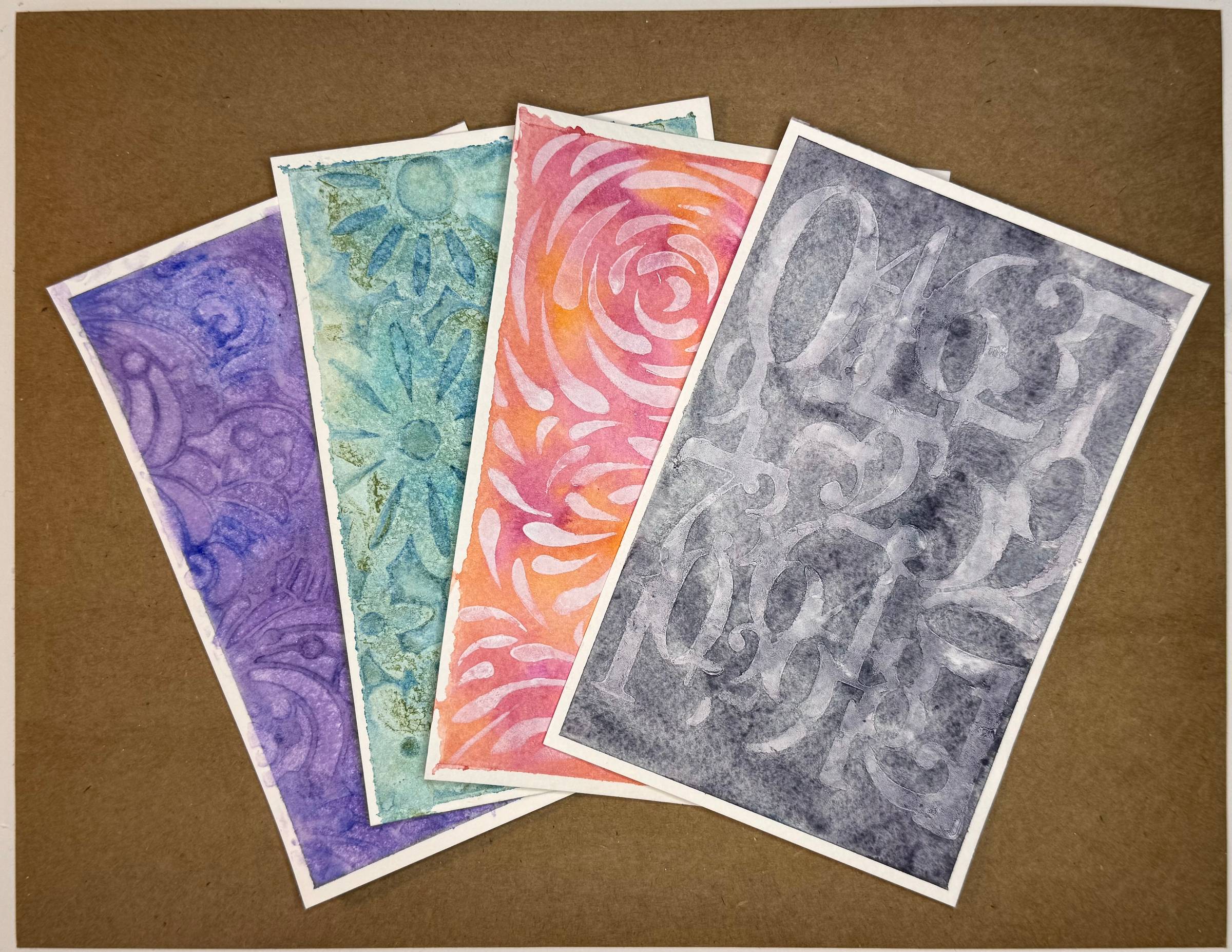 this is four watercolor backgrounds make with the stencil effects discussed in the blog