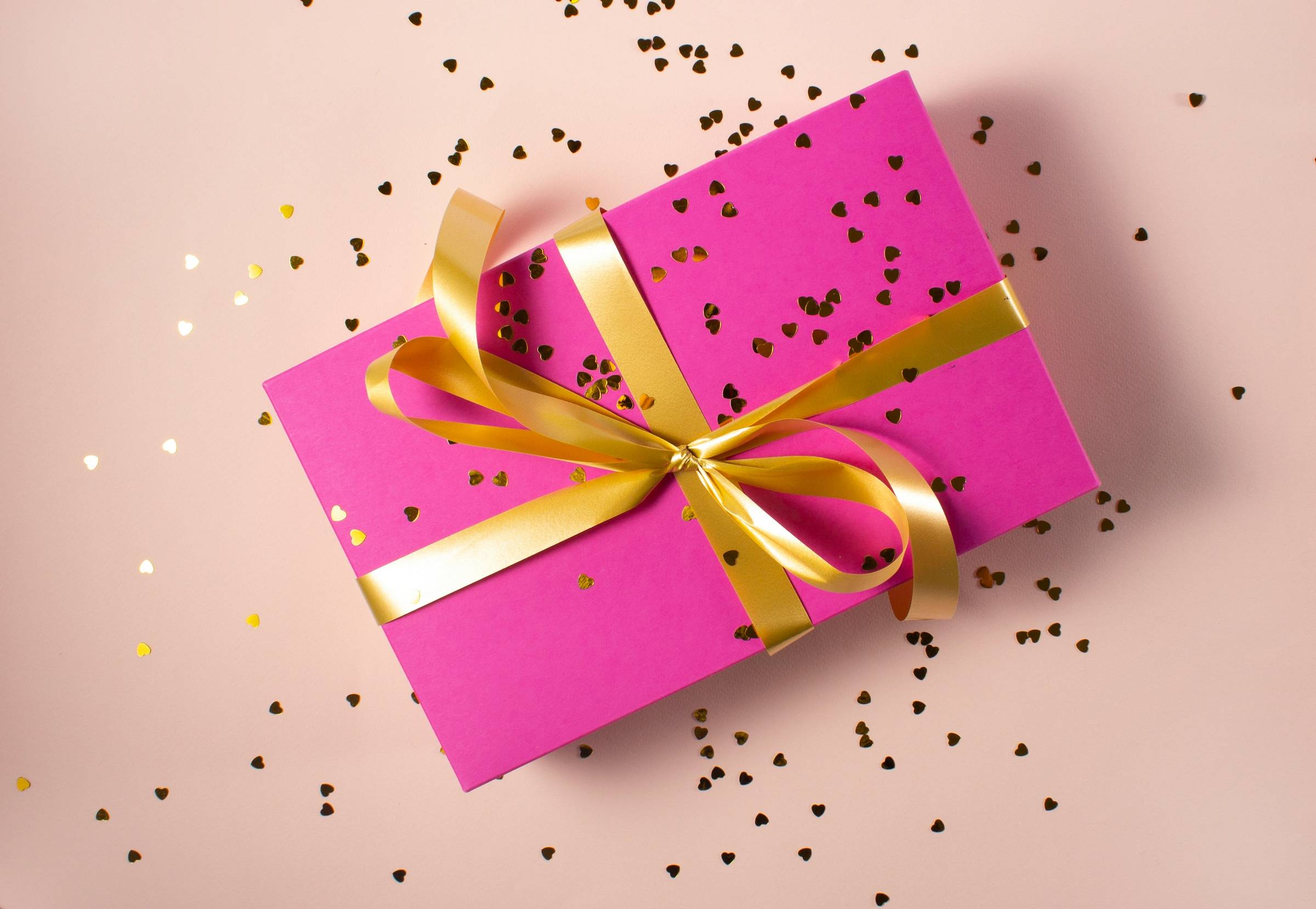 pink wrapped gift box with glitter