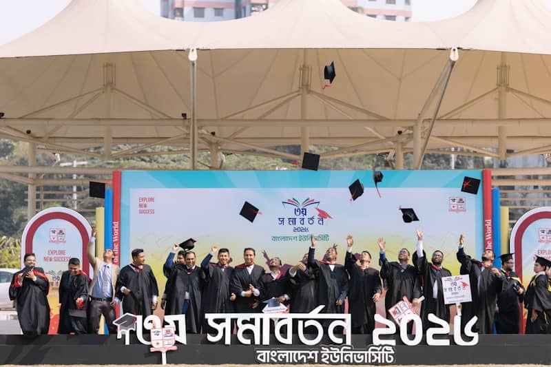 Graduates tossing caps in the air at a ceremony