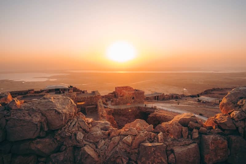 brown rock formation during sunset