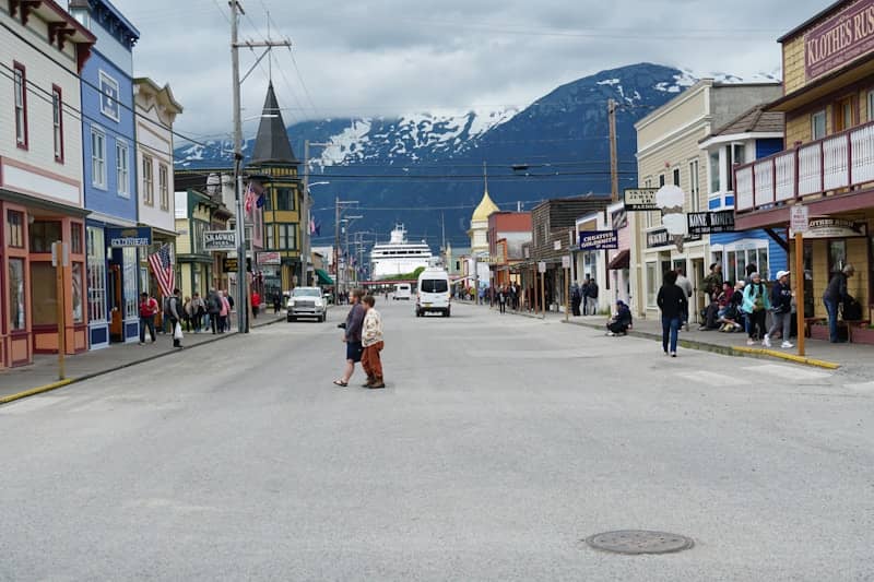 A small town with a lot of people walking down the street