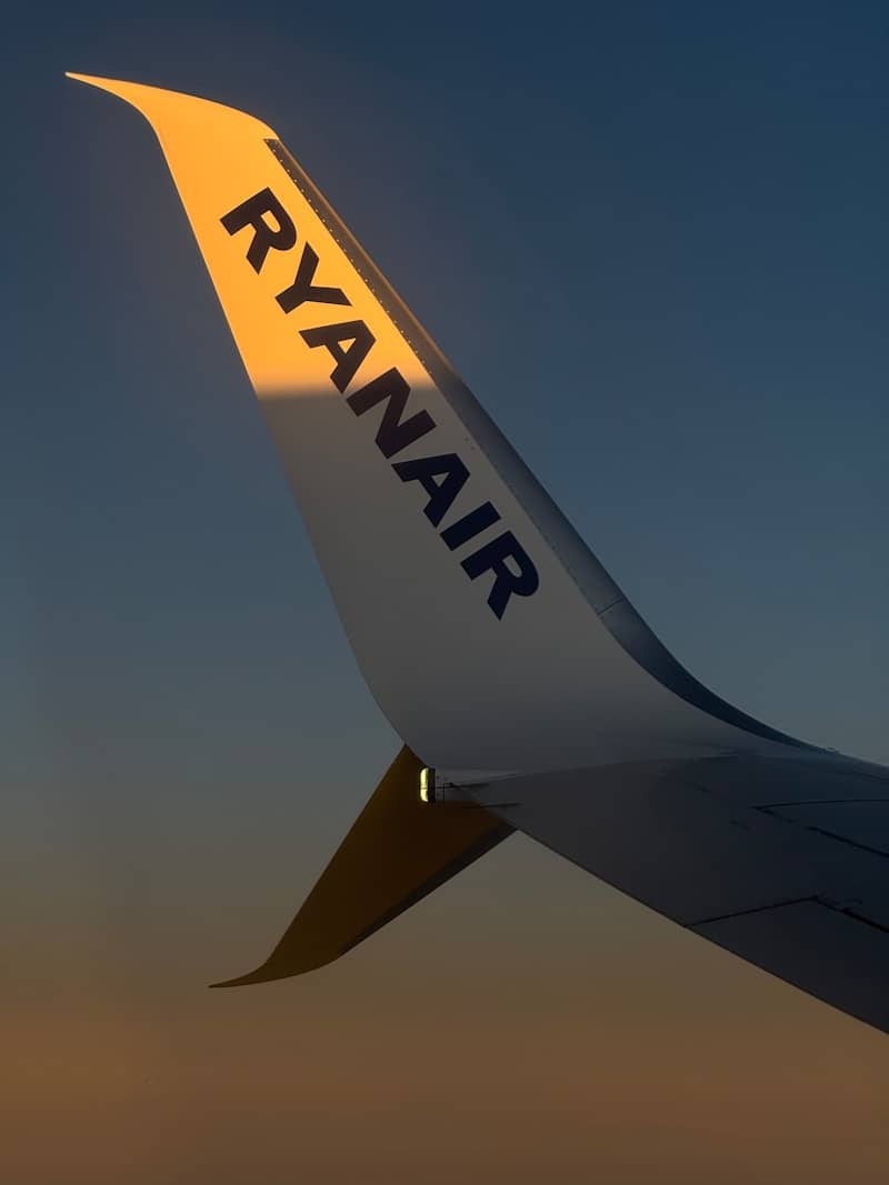 Ryanair airplane wing against a dusky sky