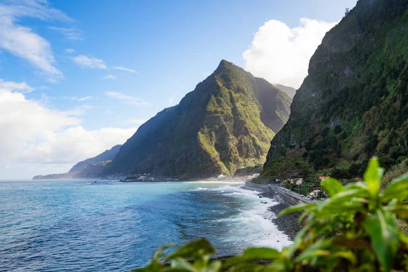 Beautiful coastal scenery with mountains and blue water.