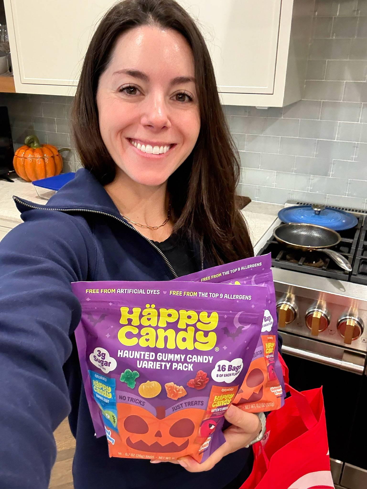 Kacie Barnes holding Happy Candy bag