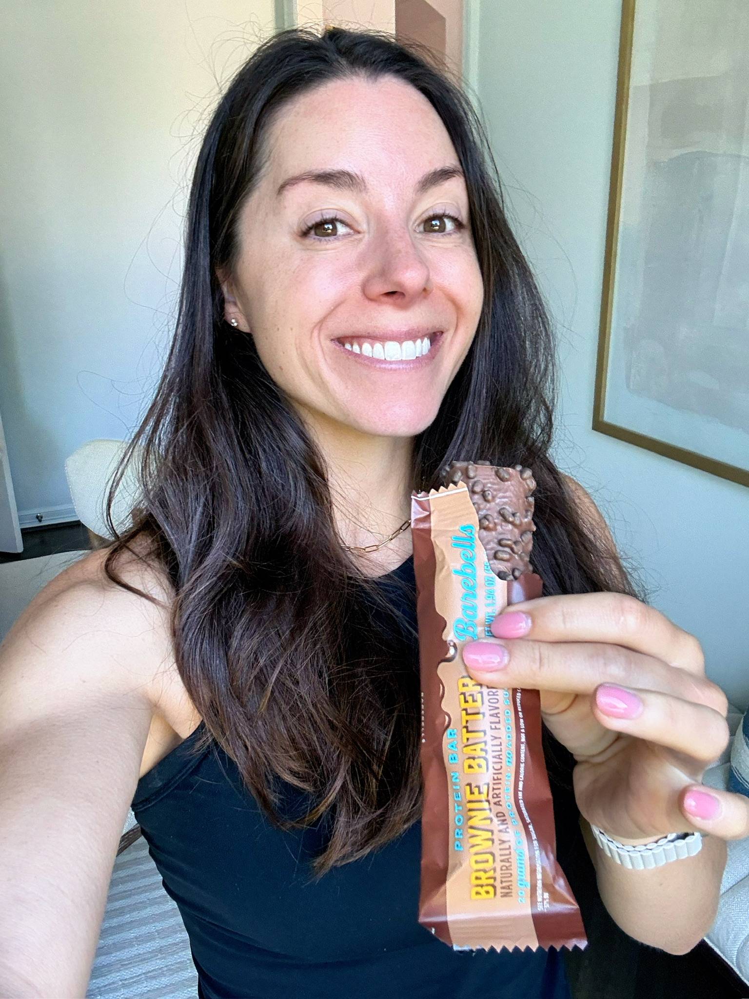 Kacie Barnes Holding Barebells Brownie Batter Protein Bar