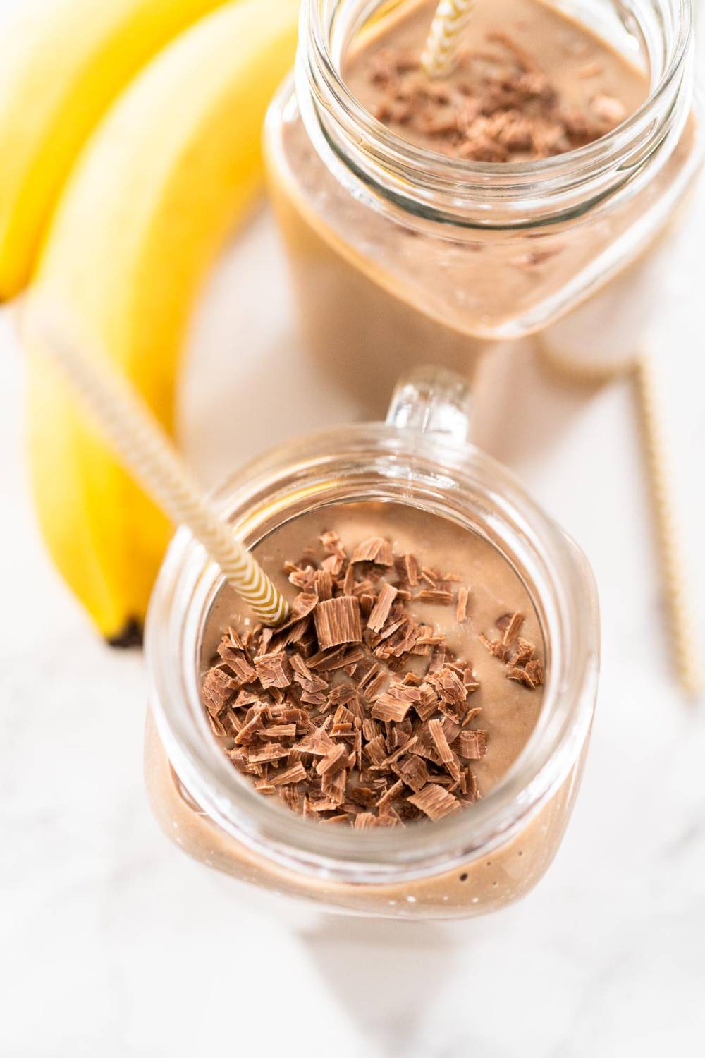 Chocolate Smoothie with Chocolat Shavings and Paper Straw in a Glass Jar Mug
