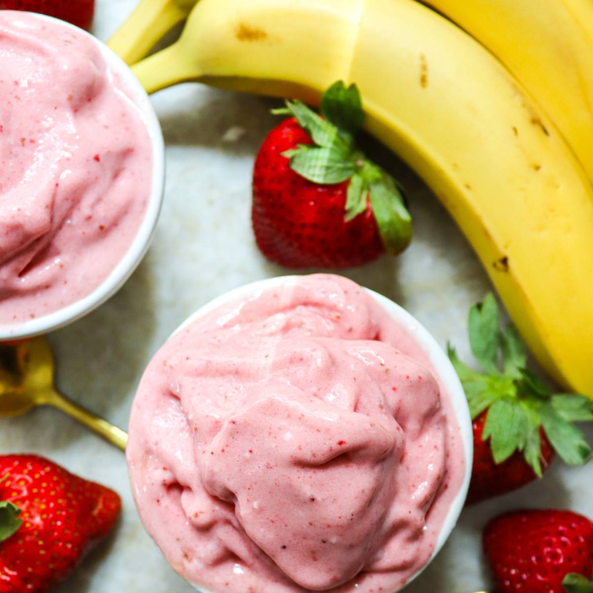 Homemade Strawberry Banana Frozen Yogurt in a White Dish