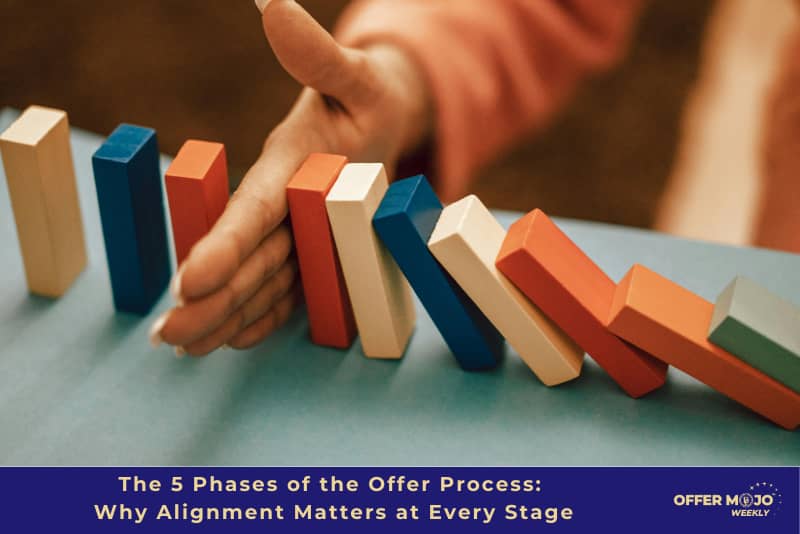 hand stopping building blocks from falling