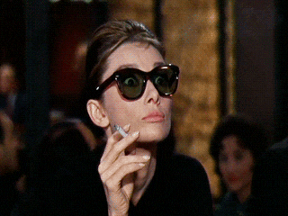 Audrey Hepburn pulling down her glasses after shopping at Tiffany's. The email is an invite to learn high-quality, ethical sales strategy.