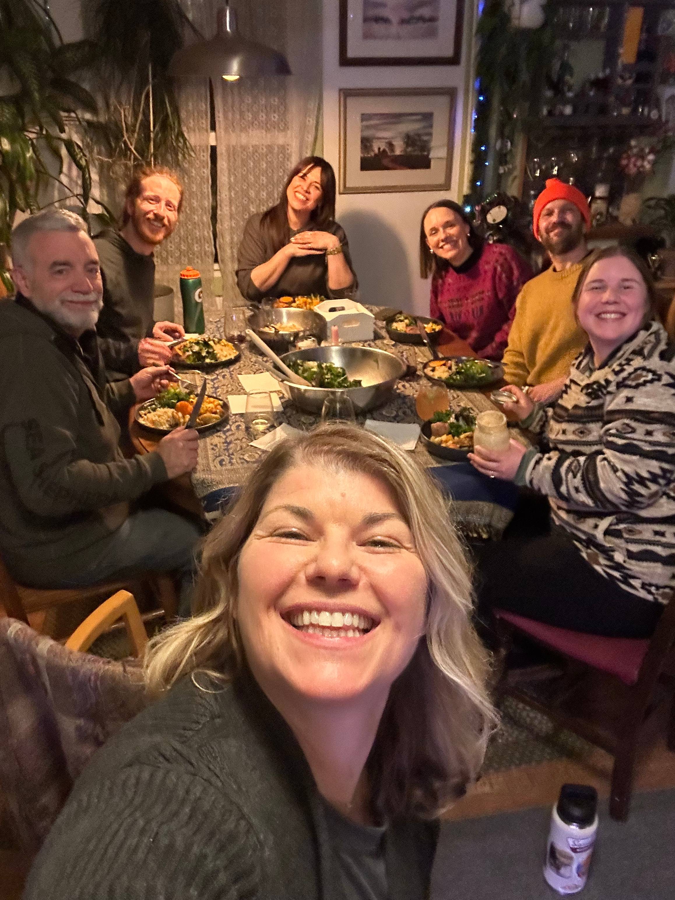 Deborah's friends and neighbors at a recent dinner party, illustrating the analogy of inviting people over to dinner being like inviting people to buy your work.