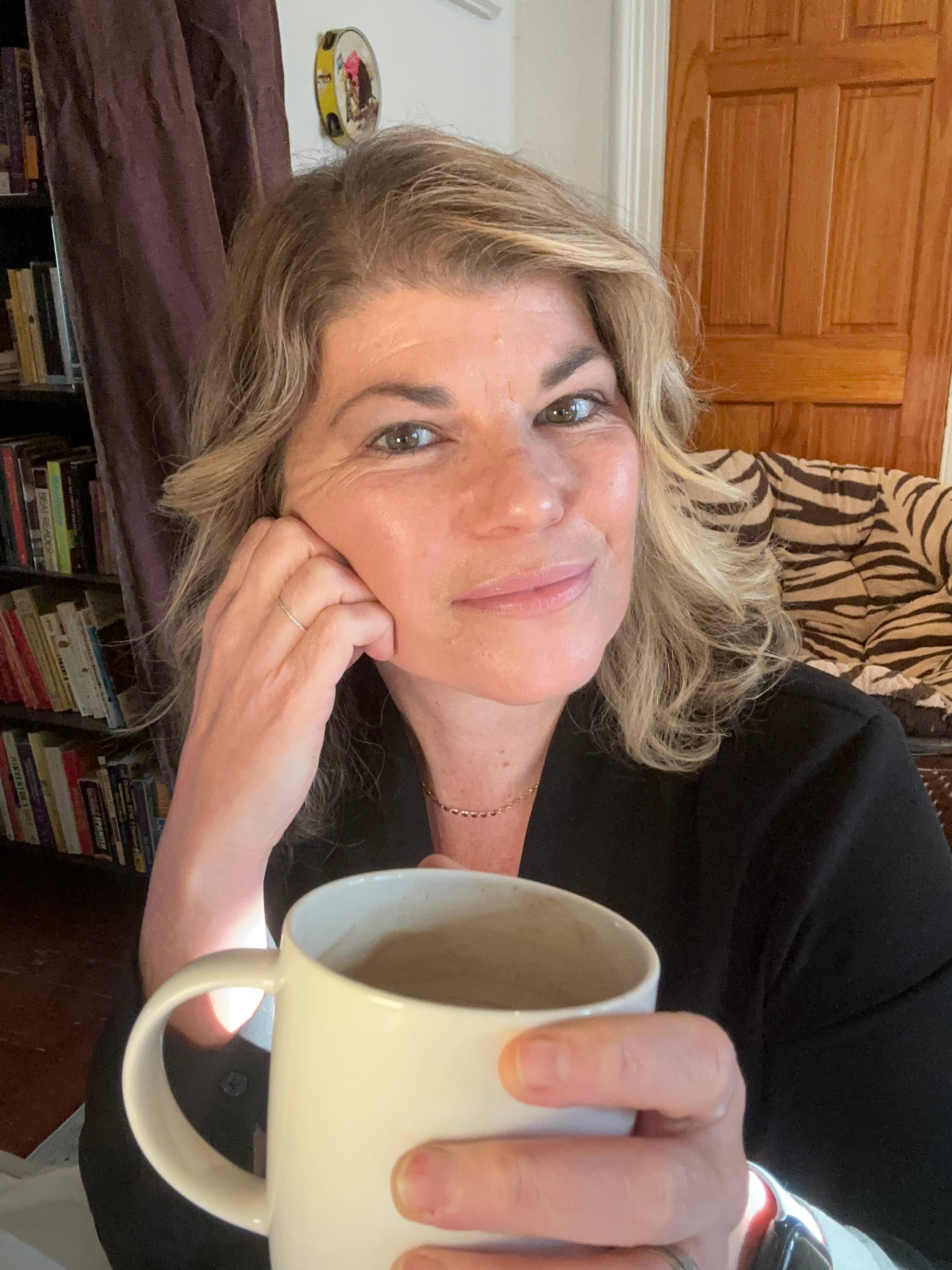 Deborah C. Smith, marketing strategist and business mentor, enjoying a cup of coffee. 