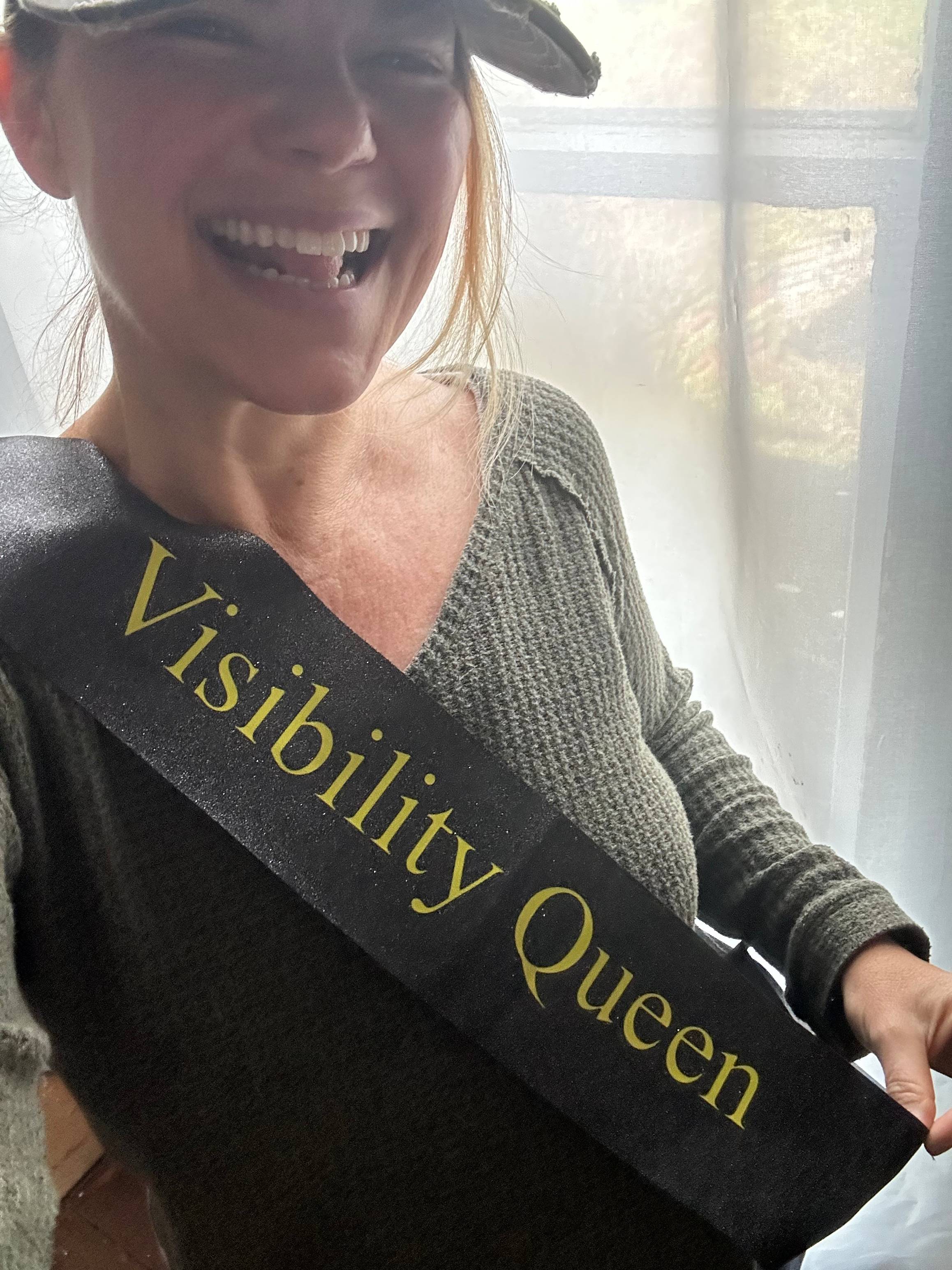 Business strategist Deborah Smith wearing her new Visibility Queen sash that she won as a people's choice award at the Women Getting Visible Conference in Washington DC. 