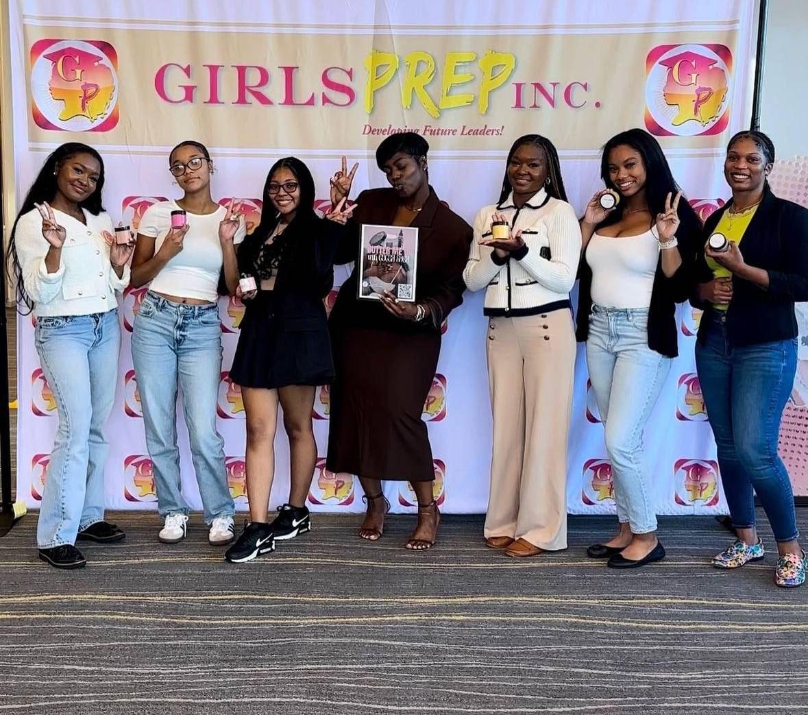 group of 7 young women posing in front of Girls PREP banner.  