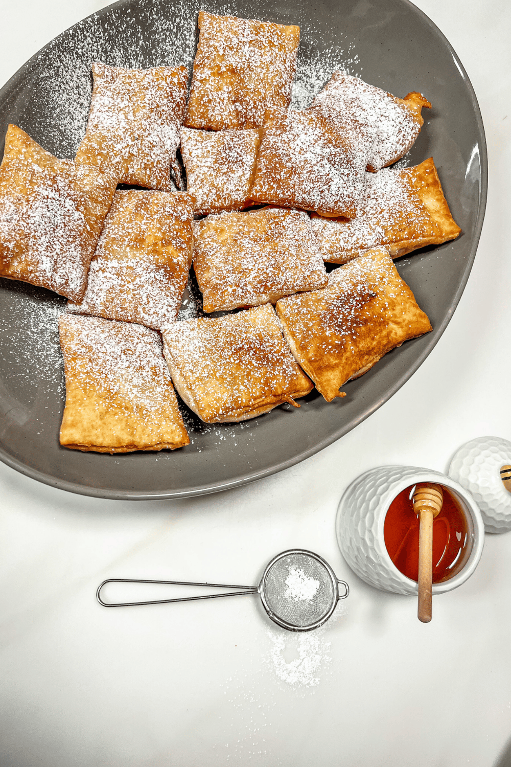 finsihed beignets with honey