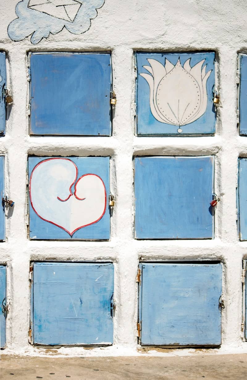 A blue and white wall with a picture of a heart on it