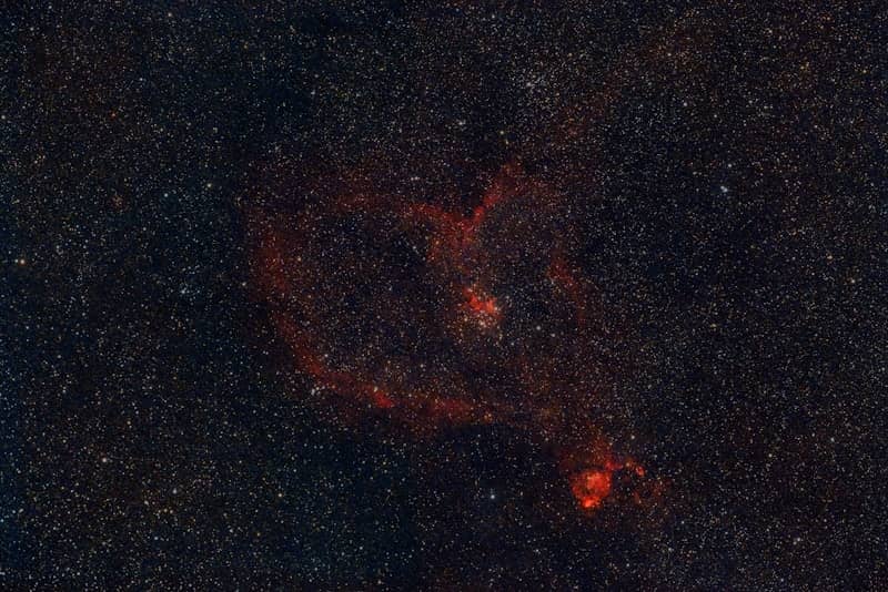 Red nebula in the starry night sky.